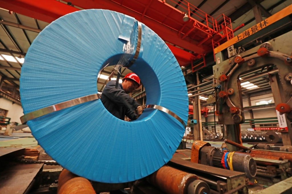 An employee of a strip steel manufacturer in Luannan county, Tangshan of north China’s Hebei province works at a production line, March 26, 2020/ Photo by Zhang Yongxin, People’s Daily Online