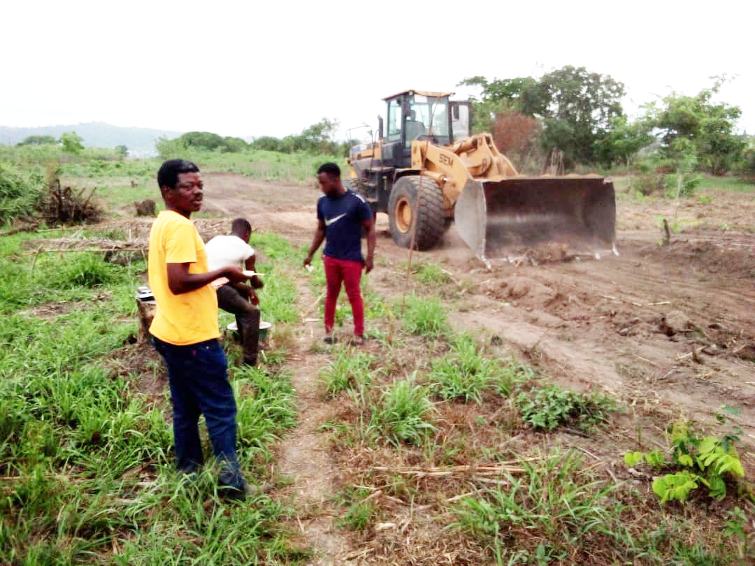 One Of The Graders Working On The Access Road