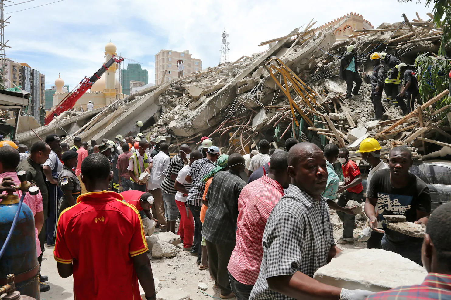 13 dead as building collapses in Tanzania; Rescuers send water through holes to trapped survivors
